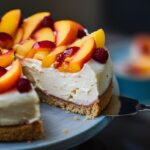 Discover the delightful fusion of flavors in our Peach Melba Cheesecake recipe, inspired by the classic dessert from French chef Auguste Escoffier. This easy-to-follow recipe combines the creamy richness of cheesecake with the refreshing taste of peaches and raspberries. With detailed steps for preparing the crust, filling, and topping, along with baking and storage tips, you can create a visually stunning and delicious dessert perfect for any occasion. Ideal for special celebrations or casual indulgence, our Peach Melba Cheesecake is sure to impress.